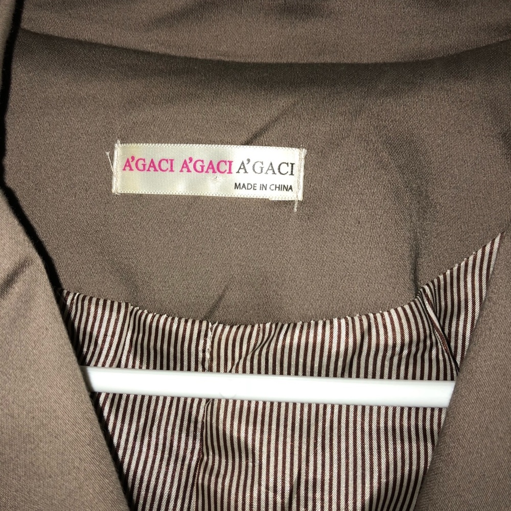 Tan jacket with pin stripe sleeves